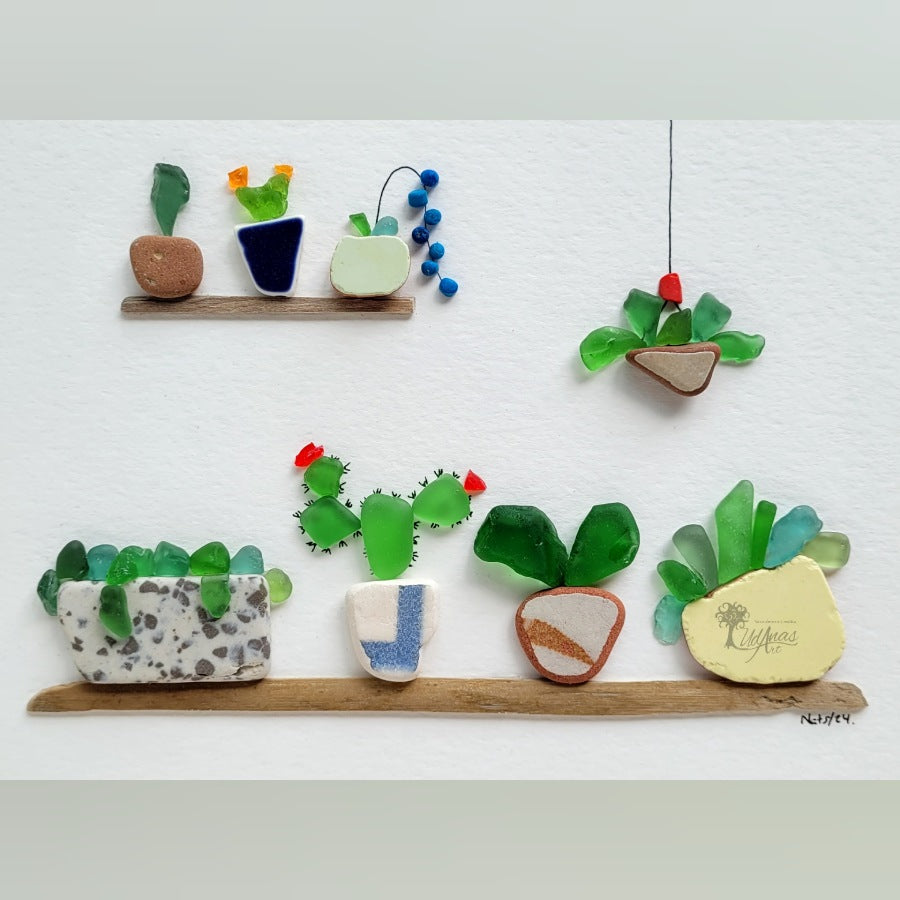 "El Jardín", cuadro hecho a mano, detalle primer plano de vidrios marinos sobre fondo blanco. 